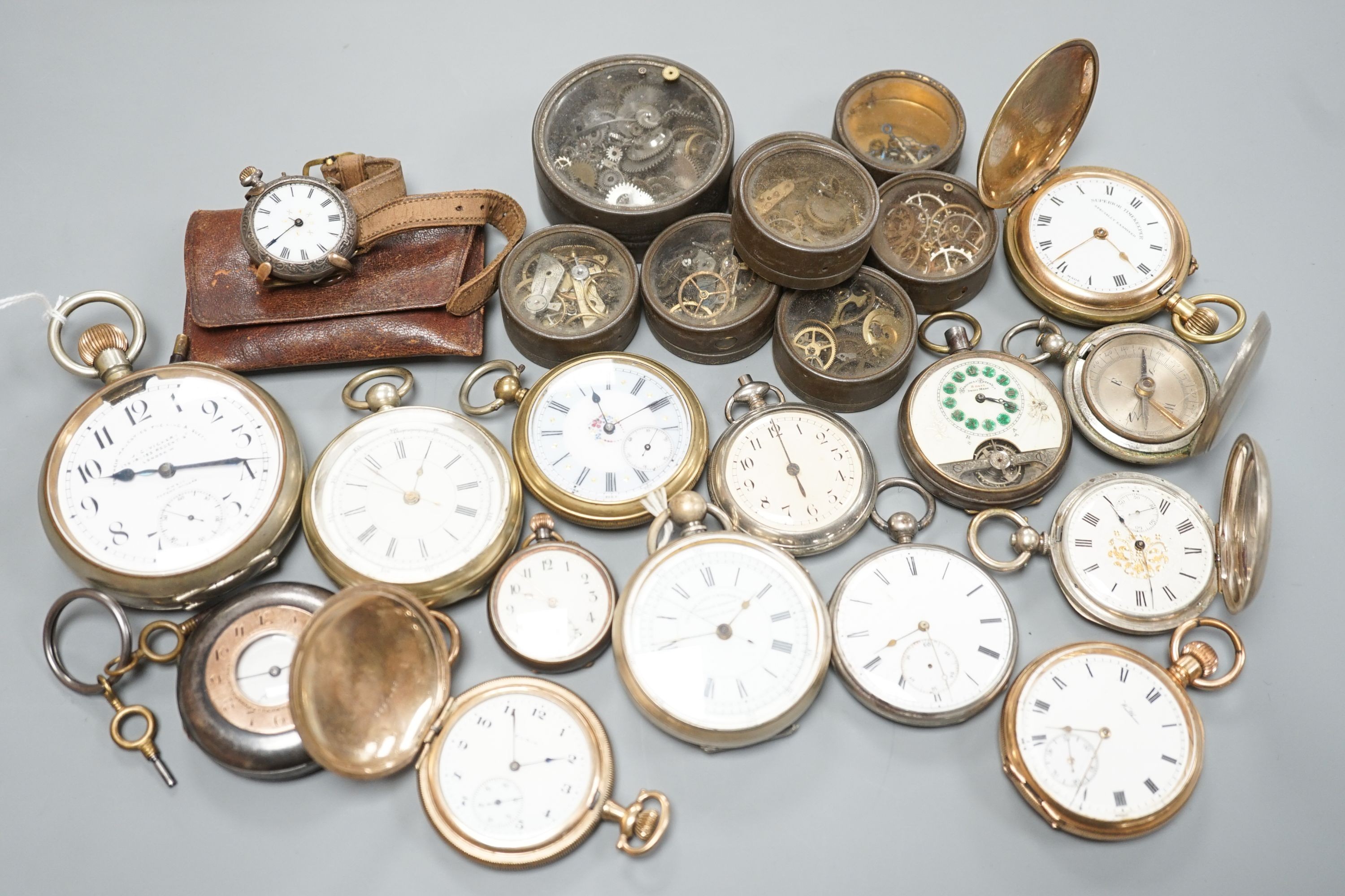 A small collection of assorted base metal and gold plated pocket watches including Hebdomas and Waltham and a small quantity of watch parts.